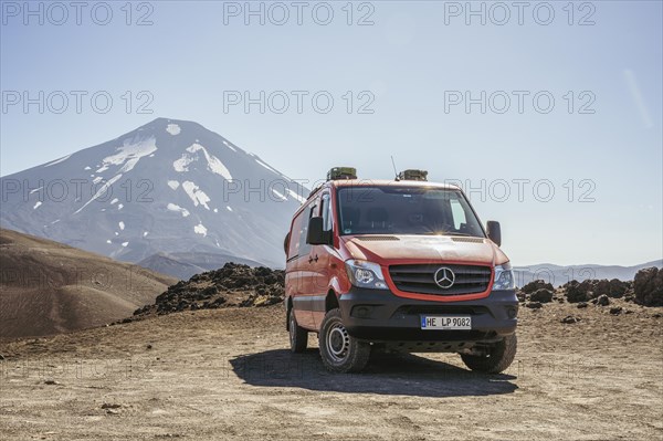 Campervan in front of the Lonquimay volcano, Lonquimay volcano, Malalcahuello National Reserve,