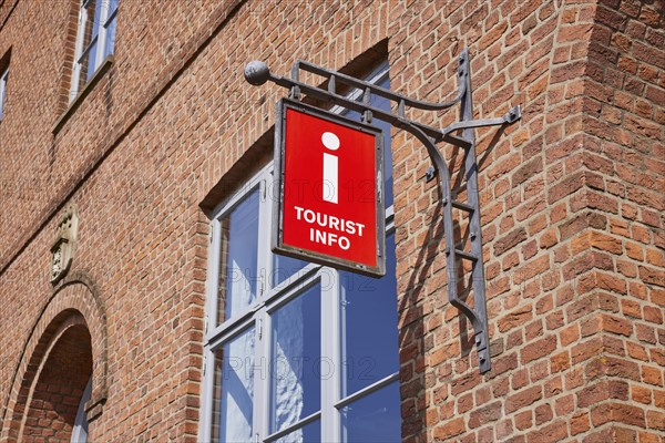 Nose sign tourist information centre at the old town hall in Husum, Nordfriesland district,