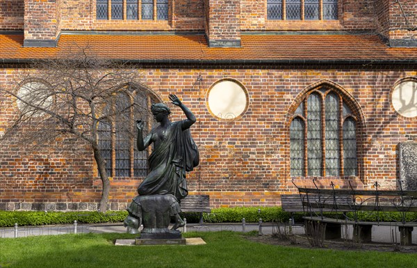 Klio statue in front of the side wing of the Nikolaikirche, Nikolaikirchplatz, Berlin, Germany,