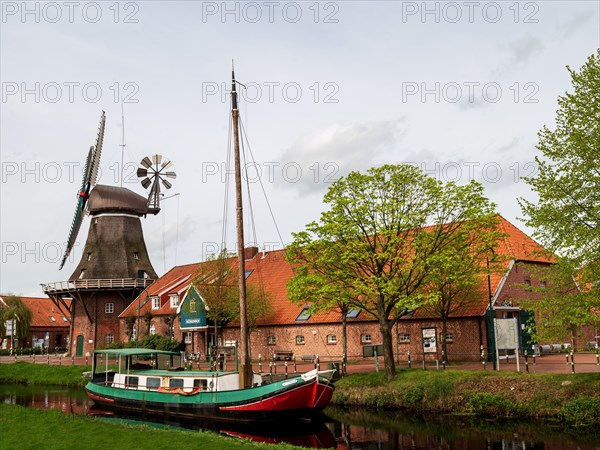 Historic windmill, gallery hollaender, traditional ship Mariechen, on the Grossefehn Canal,