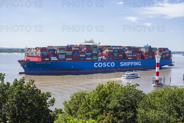 Cosco container ship and lighthouse on the Elbe, Blankenese district, Hamburg, Germany, Europe