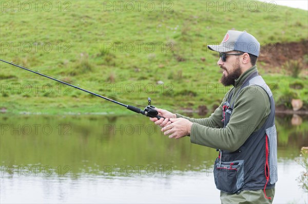 Black bass fisherman in close up, Cambara do sul, Rio Grande do sul, Brazil, South America