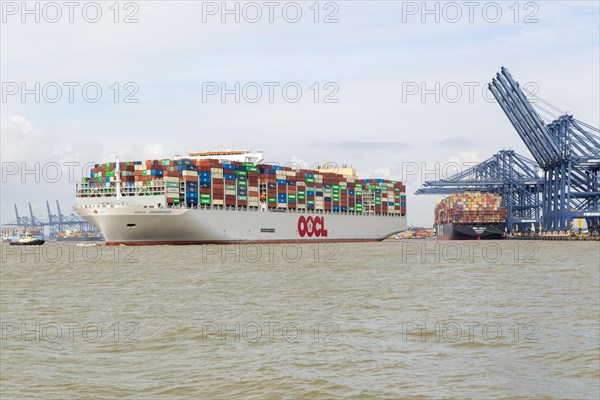 OOCL Zeebrugge container ship leaving quayside departing from Port of Felixstowe, Suffolk, England,