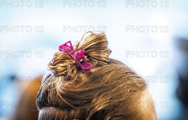 Pinned-up, wet hair, taken in the hairdressing salon Coiffeur Sivan in Berlin, 22/04/2024