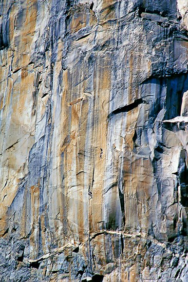 Rock face with climber, Canyon de Chelly National Monument, area of the Navajo Nation in the