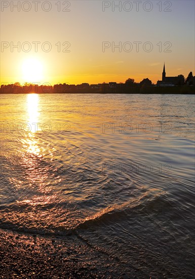Sunset over the Rhine in Neuss with a view of Volmerswerth in Duesseldorf, Lower Rhine, North