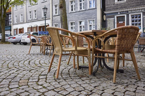 Seating area in the outdoor area of a restaurant from the frog's perspective on the church square