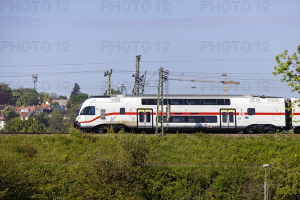 Deutsche Bahn AG InterCity en route, railway embankment and overhead lines, infrastructure,