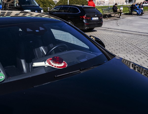 Parked police vehicle with red stop stick behind the windscreen, Berlin, Germany, Europe