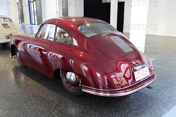 Rear view of a red Porsche 356 Coupe, exhibited in a car museum, AUTOMUSEUM PROTOTYP, Hamburg,
