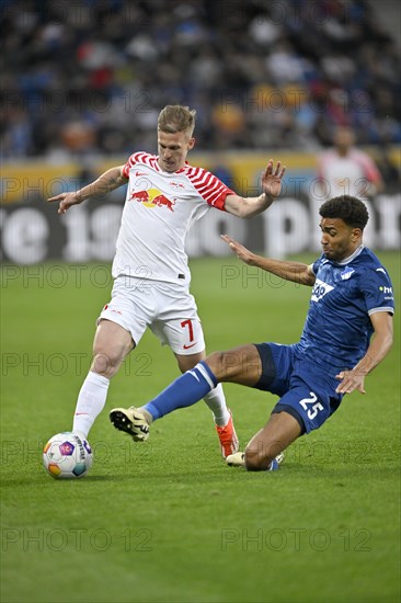 One-on-one, action Dani Olmo RasenBallsport Leipzig RBL (07) against Kevin Akpoguma TSG 1899