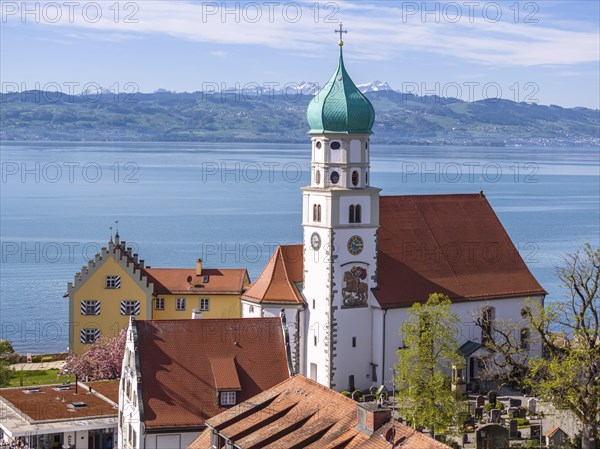 Moated castle peninsula with castle and parish church of St George on Lake Constance. Aerial view,