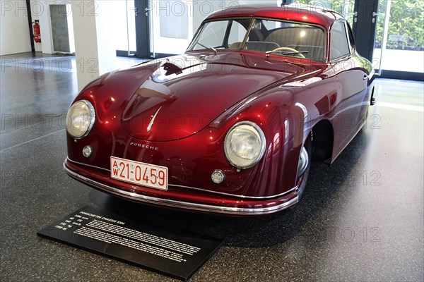 A red Porsche 356 Coupe on display, view of the front of the historic car, AUTOMUSEUM PROTOTYP,