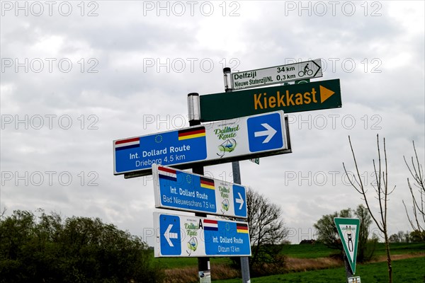 Signpost on the International Dollard Route cycle path in the border area at the Nieuwe Statenzijl