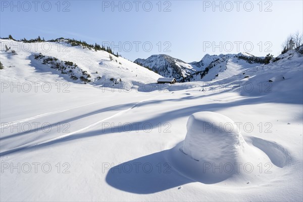 Snow-covered mountain landscape in winter at the Schnittlauchmoosalm, ski tour to the Aiplspitz,