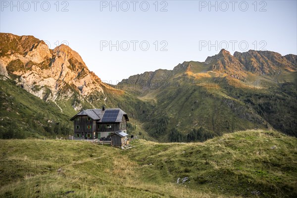 Alpine club hut, Hochweisssteinhaus mountain hut, mountain landscape with green mountain meadows