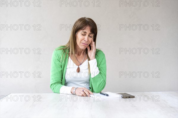 Mid-adult woman having ear pain