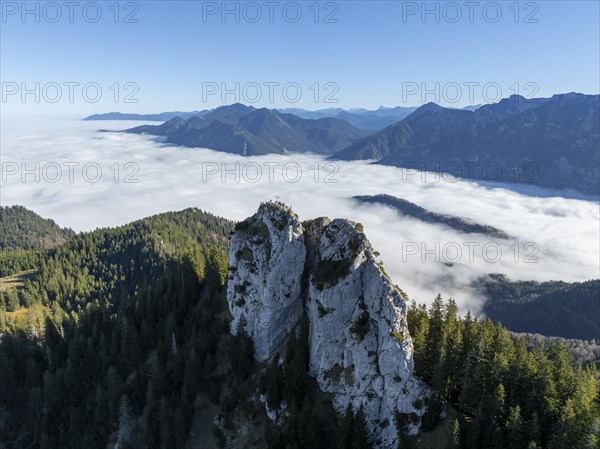 Aerial view, rocky summit of the Ettaler Manndl, view over mountain landscape and sea of clouds,