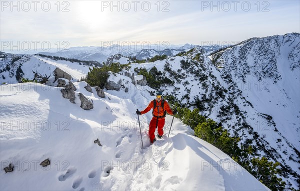Mountaineer on the ridge of the Aiplspitz in the snow, snow-covered mountain landscape with