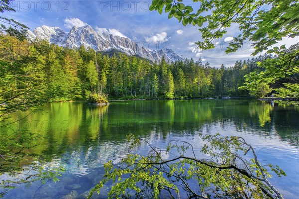 Lake Badersee in spring with Zugspitze group 2962m in the Wetterstein mountains, Zugspitz village