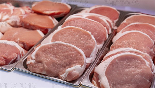 Meat, raw pork, schnitzel, in a display of a butcher's shop, AI generated, AI generated