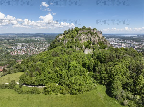 Aerial view of the Hohentwiel volcanic cone with Germany's largest fortress ruins, behind it the