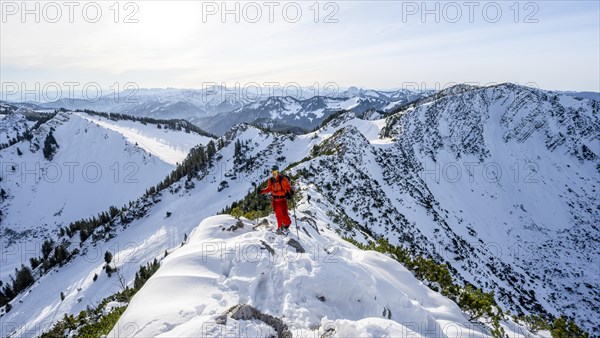 Mountaineer on the ridge of the Aiplspitz in the snow, snow-covered mountain landscape with