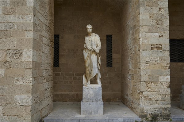 Statue of a standing figure in ancient dress in a sandstone niche, 2nd century BC statue,