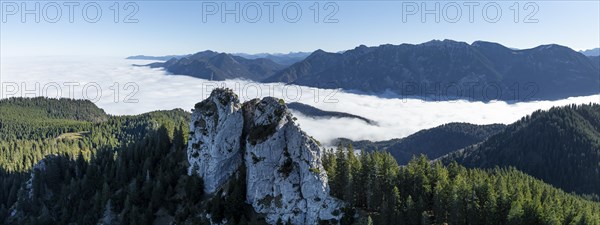 Aerial view, rocky summit of the Ettaler Manndl, view over mountain landscape and sea of clouds,