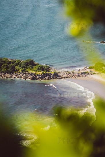 View from the vantage point of Mount Manganui with a view of the sea and a peninsula. Taken in