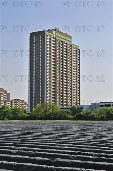 Covered asparagus field, behind it the KoelnBerg, a social hotspot in Cologne-Meschenich, North