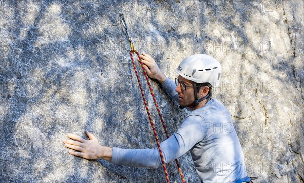 Sport climbing with rope, climber on a rock face, Frauenwasserl climbing garden, Ammergau Alps,