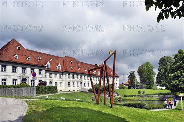 Office building of Ottobeuren Monastery with the sculpture Tre pellegrini by Erwin Roth,