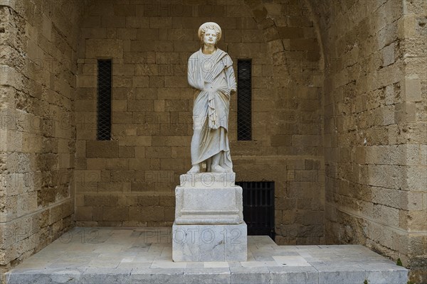 Statue of a woman in antique style with draped robe on column, Roman statue, courtyard, Grand