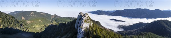 Aerial view, rocky summit of the Ettaler Manndl, view over mountain landscape and sea of clouds,