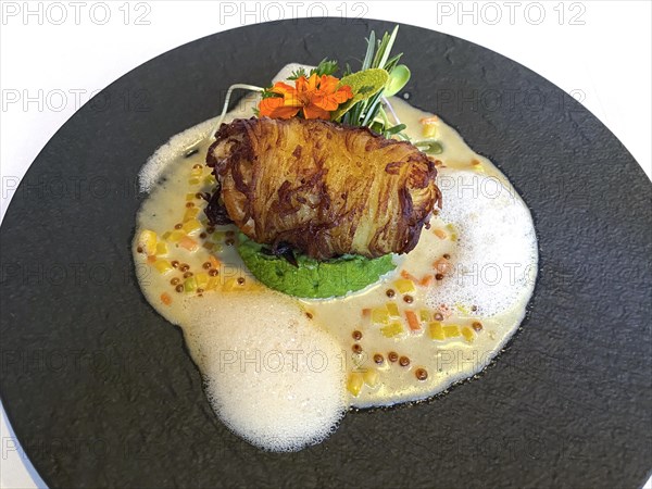 Monkfish in a potato coat, pea puree and caviar foam, Stuttgart Baden-Wuerttemberg, Germany, Europe