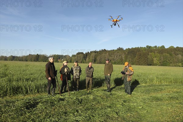 European roe deer (Capreolus capreolus) fawn rescue, the meadow to be mowed was previously searched