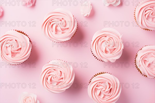 Pink cupcakes with rose flower shaped frosting, AI generated