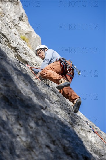 Sport climbing with rope, climber on a rock face, Frauenwasserl climbing garden, Ammergau Alps,