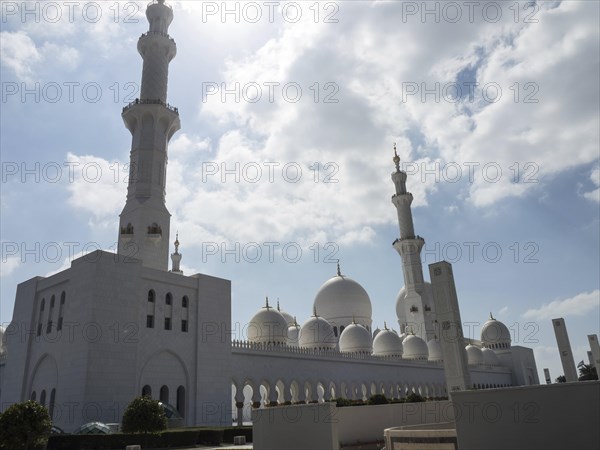 The grandiose mosque lends the sublime architecture a special beauty under the radiant sky, large