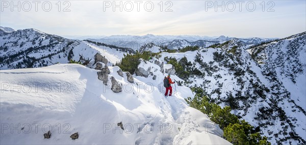 Mountaineer on the ridge of the Aiplspitz in the snow, snow-covered mountain landscape with