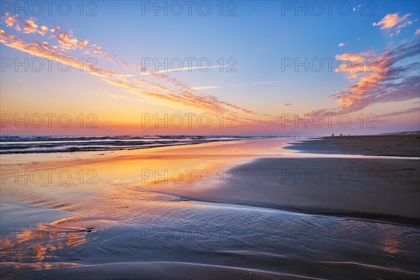 Atlantic ocean after sunset with surging waves at Fonte da Telha beach, Costa da Caparica,