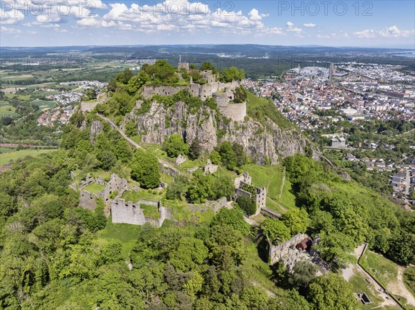Aerial view of the Hohentwiel volcanic cone with Germany's largest fortress ruins, behind it the