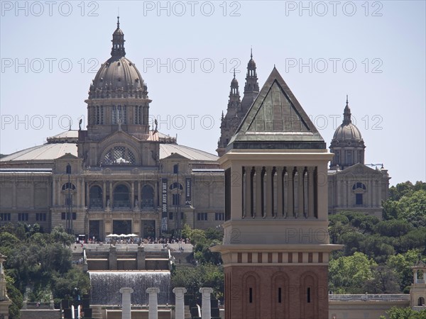Close-up of a historic building with a magnificent dome and detailed tower against the background