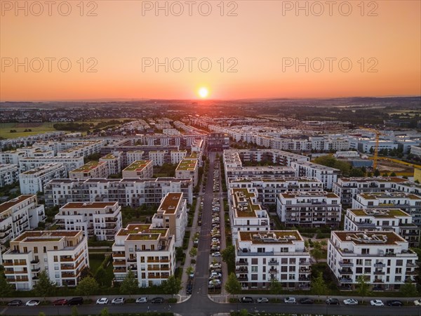 The sun rises over the Riedberg district of Frankfurt. (Aerial view with a drone), Riedberg,