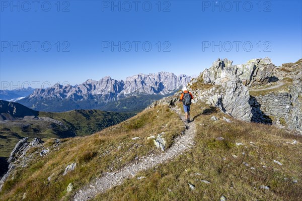 Mountaineers on a hiking trail, old war positions from the First World War, mountain panorama, view