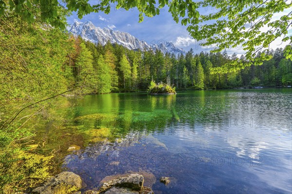 Lake Badersee in spring with Zugspitze group 2962m in the Wetterstein mountains, Zugspitz village