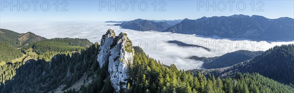 Aerial view, rocky summit of the Ettaler Manndl, view over mountain landscape and sea of clouds,