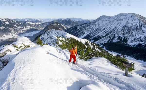Mountaineer on the summit of the Aiplspitz in the snow, snow-covered mountain landscape with