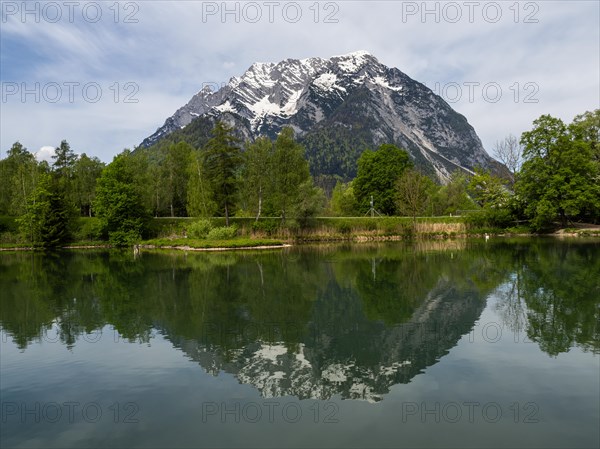 Grimming is reflected in See, Trautenfels near Liezen, Styria, Austria, Europe